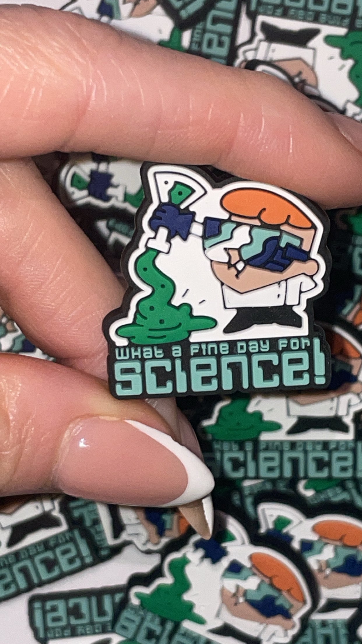 Cartoon science lab Croc charms set with beakers and goggles designs”
“Retro scientist-themed Croc charms on blue and orange Crocs shoes”
“90s cartoon-inspired Croc charms flat lay – beaker, robot, and test tube designs”
“Science and experiment Croc charms set for cartoon fans”
“Colorful science Croc charms gift set – nostalgic 90s cartoon style”