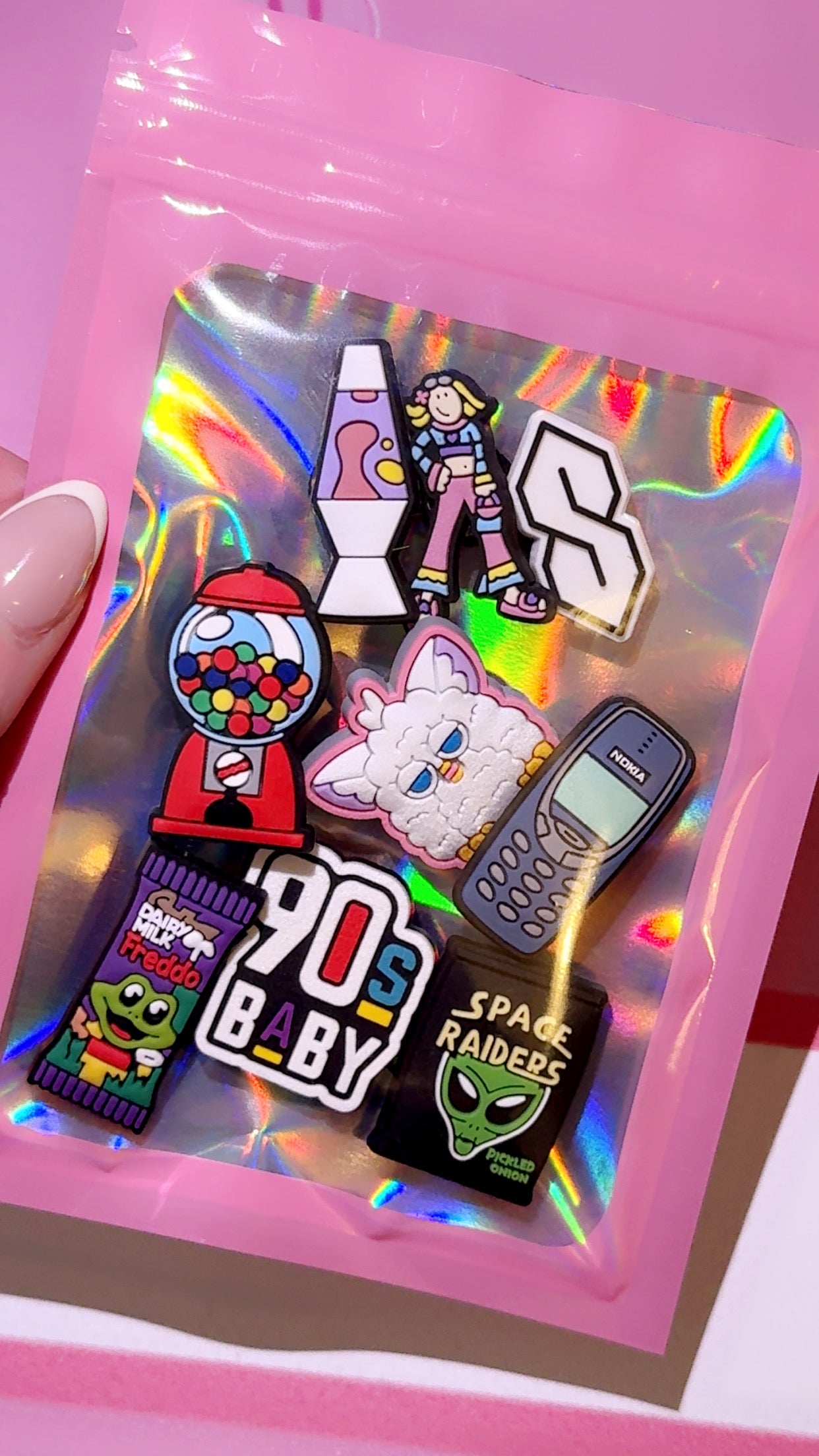 90s nostalgia Croc shoe charms aesthetic bundle on pink background