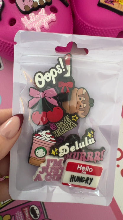 Ten-piece girly shoe charm set featuring playful quotes, coffee, cherries, lipstick and food designs.