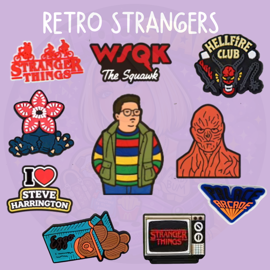 Set of retro 80s mystery inspired croc charms featuring arcade, creature, and vintage TV style designs on a purple background