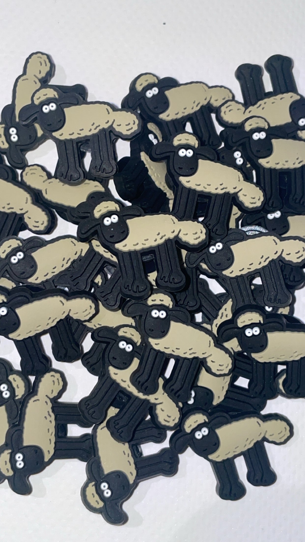 British cartoon-inspired Croc charms set with cheese and dog designs”

“Inventor and pet-themed Croc charms on grey and yellow Crocs shoes”

“Clay animation-style Croc charms flat lay – cheese, teapot, and gadget icons”

“Funny British-inspired Croc charms set for nostalgic fans”

“Cheese and clever dog Croc charms gift set – inspired by classic animation”