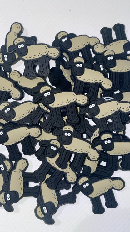 British cartoon-inspired Croc charms set with cheese and dog designs”

“Inventor and pet-themed Croc charms on grey and yellow Crocs shoes”

“Clay animation-style Croc charms flat lay – cheese, teapot, and gadget icons”

“Funny British-inspired Croc charms set for nostalgic fans”

“Cheese and clever dog Croc charms gift set – inspired by classic animation”