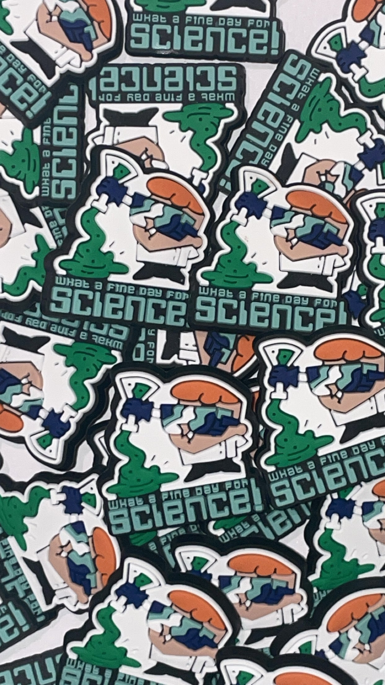 Cartoon science lab Croc charms set with beakers and goggles designs”

“Retro scientist-themed Croc charms on blue and orange Crocs shoes”

“90s cartoon-inspired Croc charms flat lay – beaker, robot, and test tube designs”

“Science and experiment Croc charms set for cartoon fans”

“Colorful science Croc charms gift set – nostalgic 90s cartoon style”