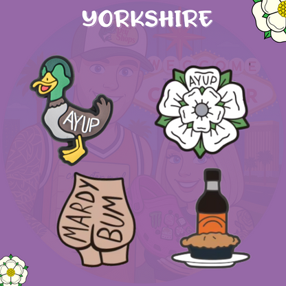 Yorkshire-themed Croc charms featuring a duck with 'Ay Up' text, white Yorkshire rose, 'Mardy Bum' charm shaped like a bum, and a meat pie with gravy bottle on a purple background