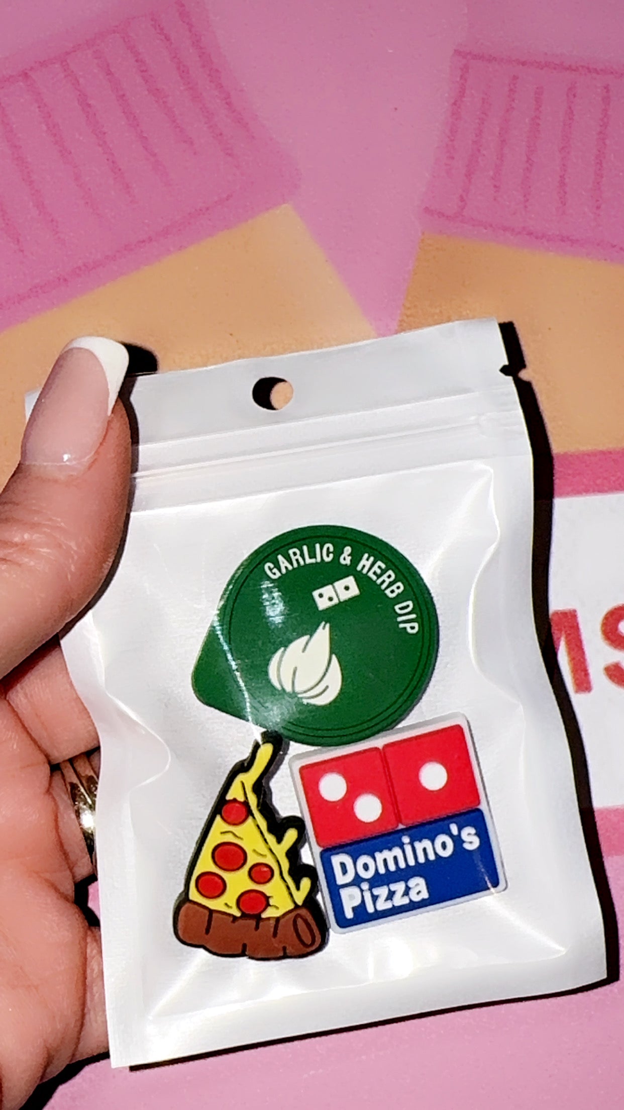 Pizza themed croc charms featuring a cheesy slice, dipping sauce and takeaway style design on a purple background