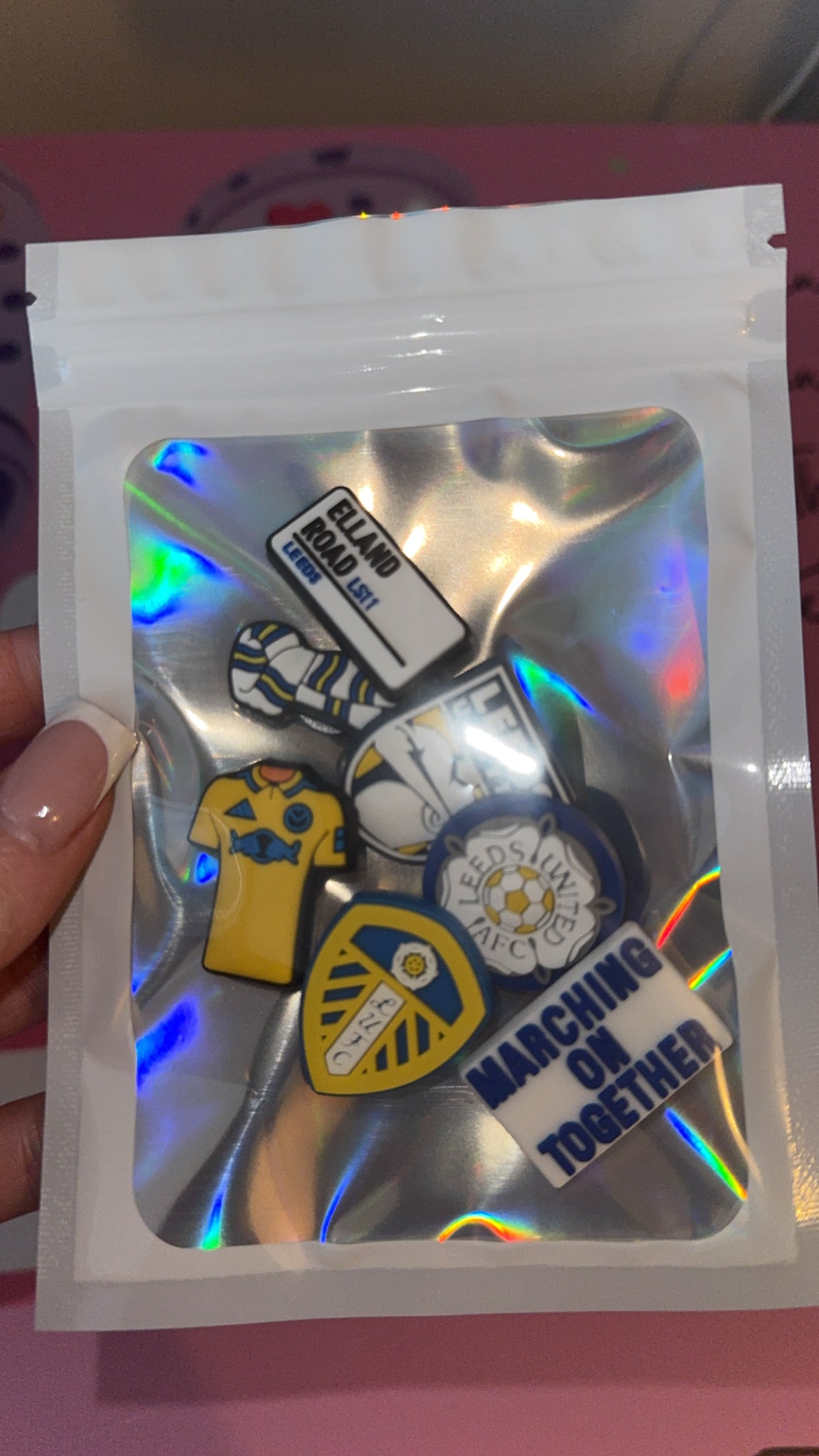 ports croc charm bundle displayed in holographic packaging