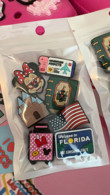 Florida travel shoe charm set with a pink suitcase, bow, castle and travel ticket