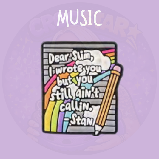letter themed croc charm with colourful notebook illustration