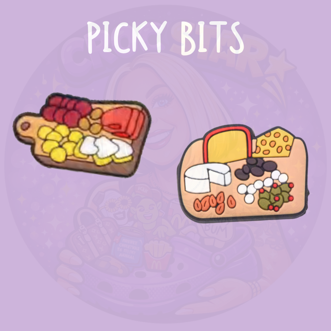 Two picky-bits-themed shoe charms featuring miniature grazing boards with cheese, crackers, grapes and olives