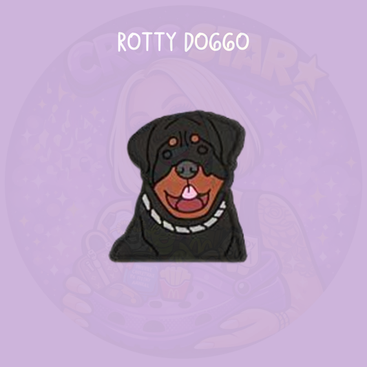 Cute cartoon rottweiler dog croc charm with black and brown colouring and collar on a purple background