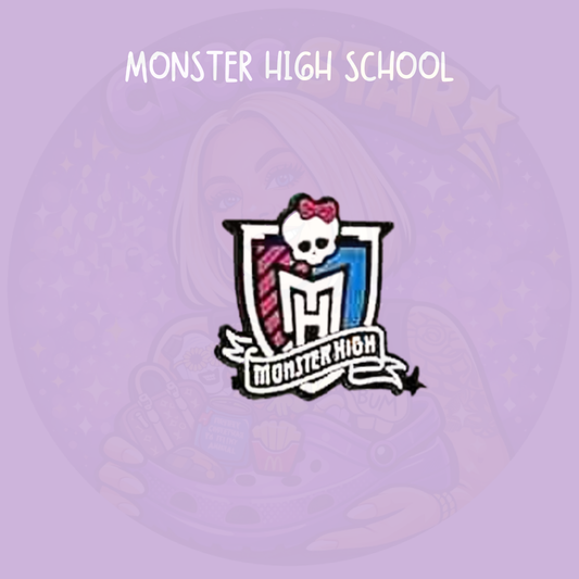 Gothic monster inspired croc charm with skull and school crest design in pink blue and black on a purple background