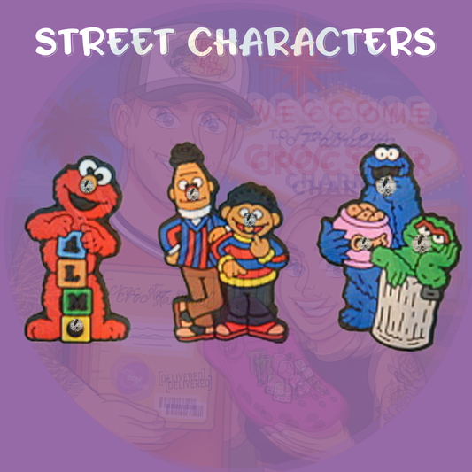 A colorful set of Croc charms featuring cheerful, fuzzy monster characters with big eyes and playful expressions. Designs include a red character with a round nose, a blue cookie-loving monster, a yellow bird, and other friendly figures from a classic children's puppet show. Made from soft rubber, perfect for adding a fun and nostalgic touch to Crocs.