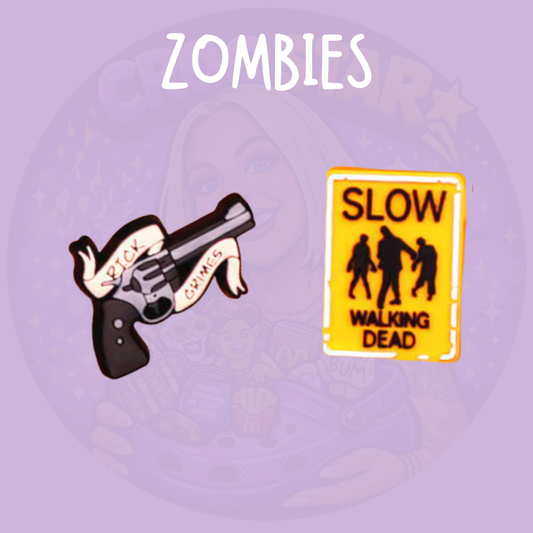 The Walking Dead Croc charms featuring a zombie-themed gun design and Slow Walking Dead road sign, The Walking Dead zombie horror shoe charms featuring undead road sign and zombie firearm designs for Crocs