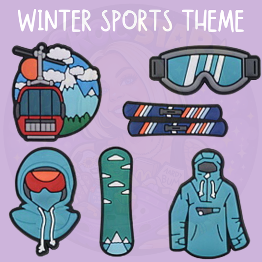 Winter sports themed shoe charms featuring a ski lift and snowy mountain, ski goggles, skis, a blue hoodie, snowboard and blue winter jacket.