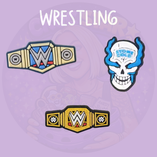 Wrestling Croc charms featuring championship belt designs and a blue flame skull wrestling graphic